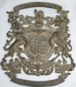 A 'Purveyors of Tea' armorial brass plaque, height 39cm