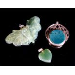 A nephrite moth pendant, 46mm, a similar heart pendant and a yellow metal mounted chalcedony