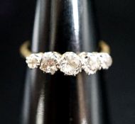 An 18ct, plat and graduated five stone diamond set half hoop ring, size N, gross 3.1 grams.