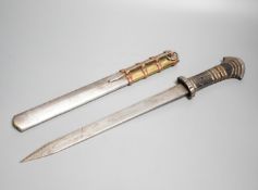 A large Tibetan dagger, early 20th century, horn handle with layers of copper and brass, iron