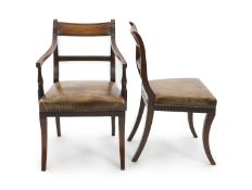 A set of fourteen Regency and later mahogany dining chairs, including two carvers,with reeded tablet