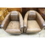 A pair of contemporary brown leather club chairs, in the Art Deco style, width 72cm, depth 80cm,