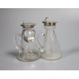 Two George V silver mounted glass whisky tot jugs, Birmingham, 1911 and 1923, 11.7cm, the latter