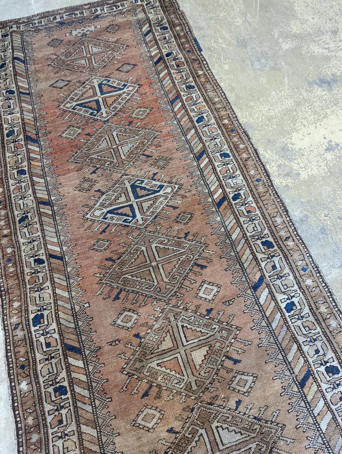 An antique Caucasian red ground runner, 372 x 106cm - Image 5 of 7