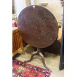 A George III circular oak tilt top tea table, diameter 74cm, height 68cm