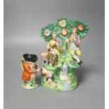 A Staffordshire figure group and character jug 21cm