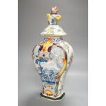 A large 19th century Delft polychrome vase and cover, 46cm, some damage