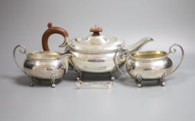 A modern silver three piece tea set by Joseph Gloster Ltd, Birmingham, 1974, gross weight 33oz and a