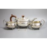 A modern silver three piece tea set by Joseph Gloster Ltd, Birmingham, 1974, gross weight 33oz and a