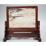 A 19th century Chinese dreamstone table screen, inscribed with one seal, height 23cm