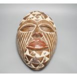An African tribal mask, height 36cm
