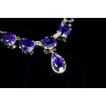 A 9ct gold and six stone oval and pear cut amethyst set drop necklace, 48 grams.7cm, gross weight