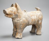 A Chinese painted grey pottery figure of a dog, probably Han dynasty, length 32cm, with 1991