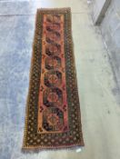 An Afghan geometric runner, 300 x 86cm