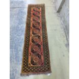 An Afghan geometric runner, 300 x 86cm