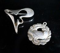 A Georg Jensen sterling abstract brooch, no. 324, 41mm and a Georg Jensen sterling pendant (