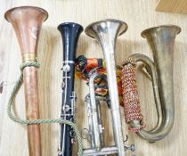 A Boosey and co Clarinet H.75983, plated trumpet, brass bugle and a copper hunting horn 87cm