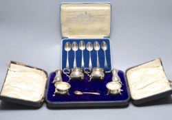 A cased set set of six 'British Hallmark' teaspoons and a cased part silver condiment set.