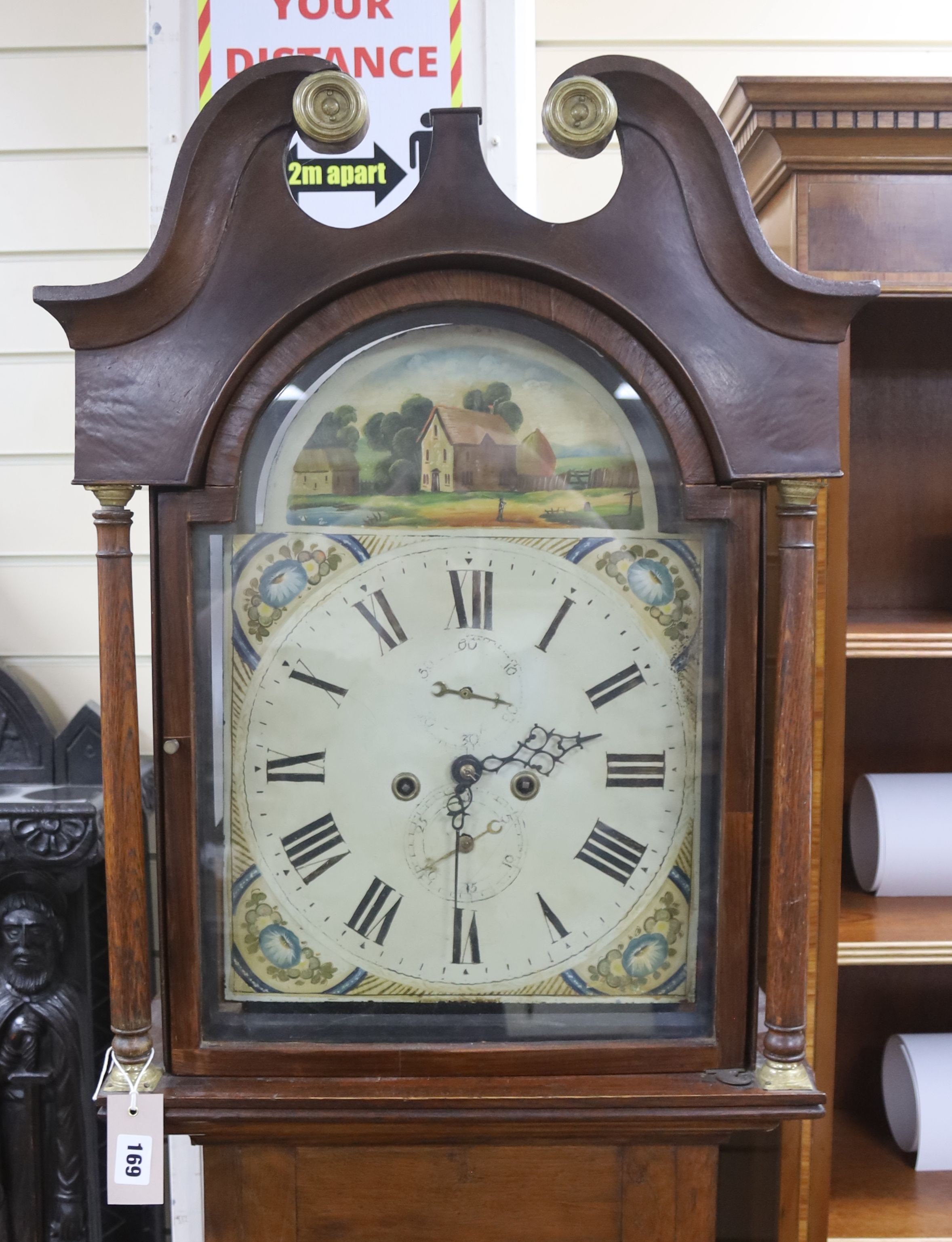 An early 19th century 8-day oak longcase clock, painted dial, with key, pendulum and weights, height