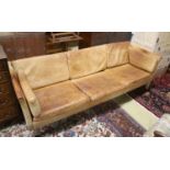 A Danish Borge Mogensen style tan leather three seater sofa, length 218cm, depth 78cm, height 66cm