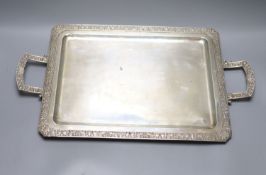 A continental white metal two handled tea tray, stamped Hernandez, 53.9cm over handles, 41.5oz.
