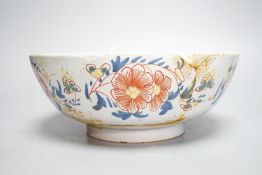 An 18th century English polychrome delftware bowl, interior inscribed "Success to The British Arms",