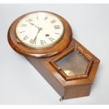 A small late 19th century beech drop dial timepiece with key and pendulum 31cm