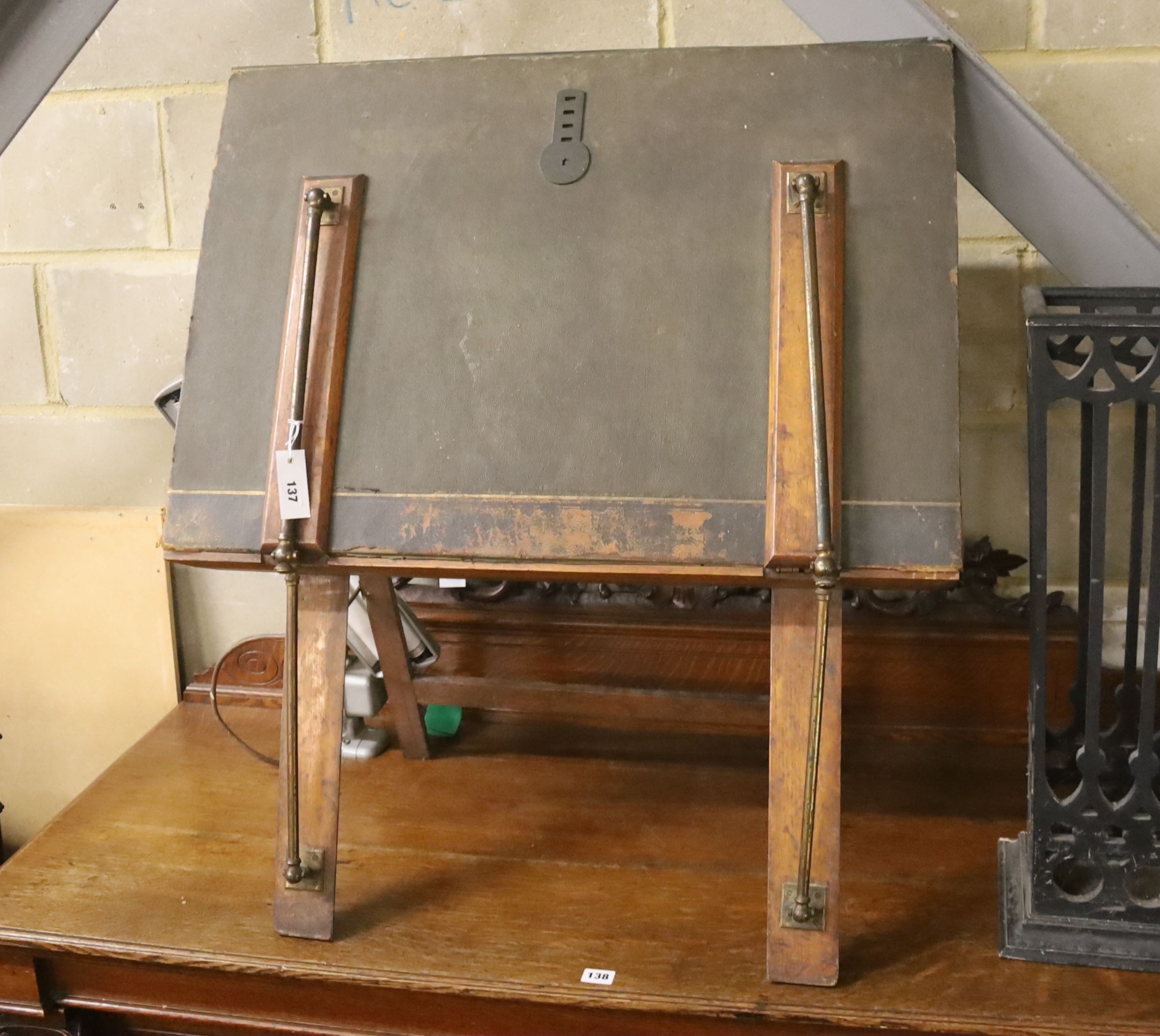 An early 20th century brass mounted folio stand together with a reading lamp