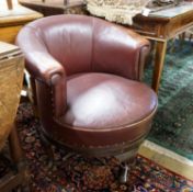 A late Victorian mahogany burgundy leather tub frame swivel desk chair, width 72cm, depth 62cm,