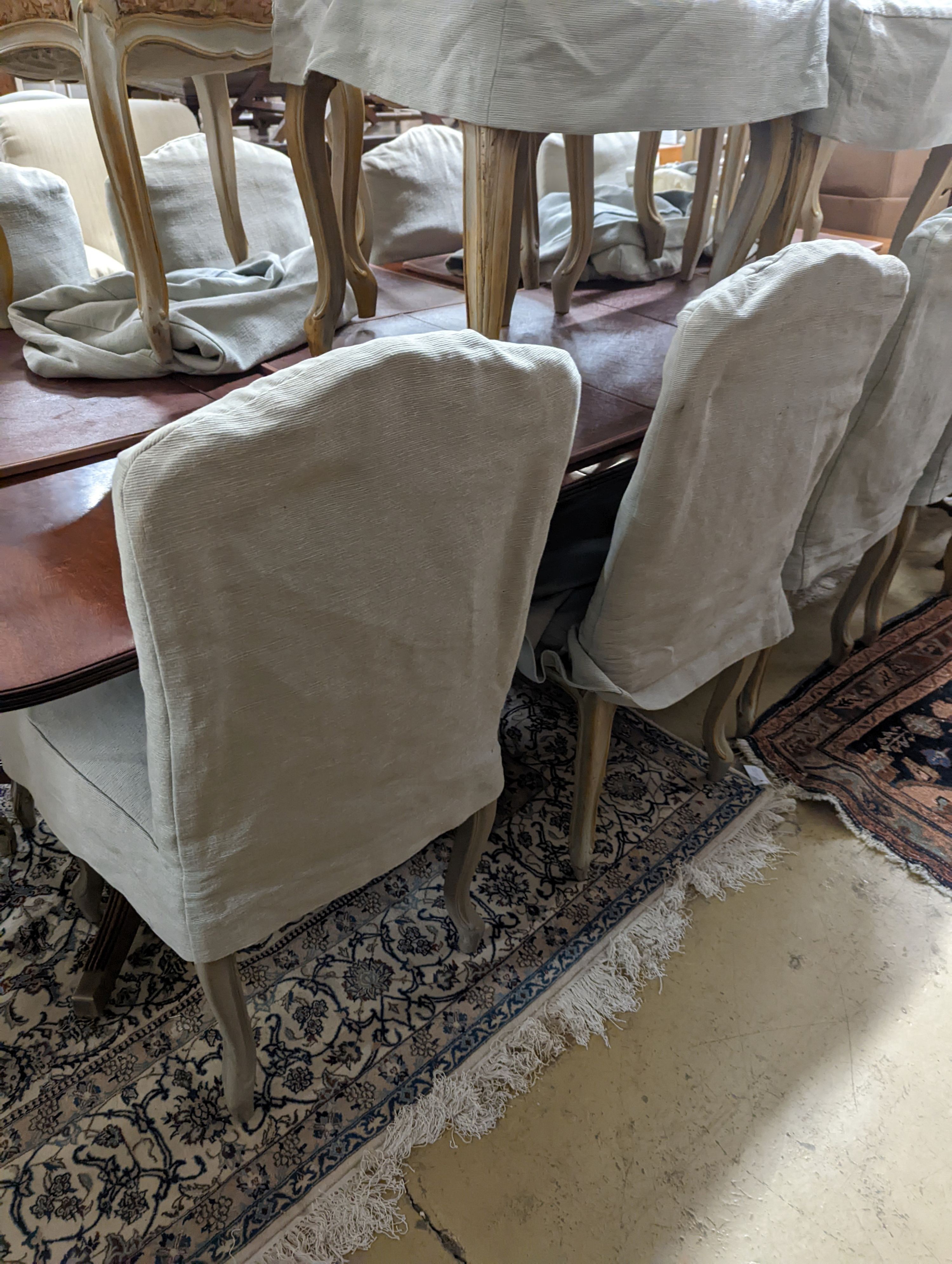 A set of fourteen French Louis XV style painted upholstered dining chairs with loose covers - Image 6 of 9