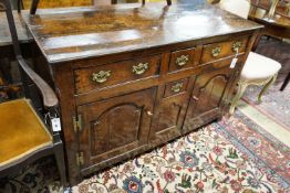 A mid 18th century oak dresser base, length 140cm, depth 55cm, height 88cm