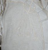 A box of mixed linen and 1950's hand embroidered cream curtain