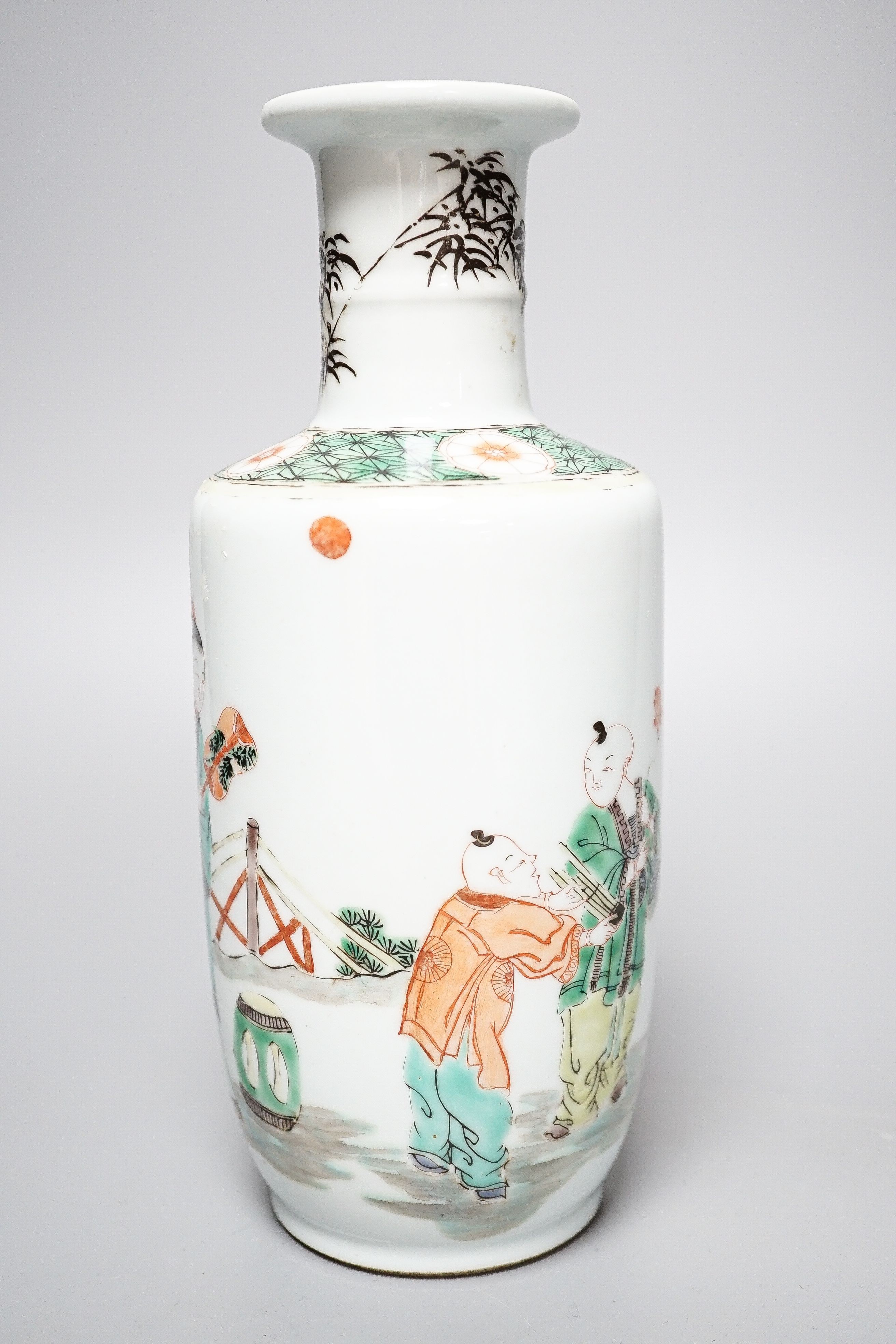 A Chinese famille verte rouleau vase, painted with figures in a garden, 22cm - Image 2 of 4