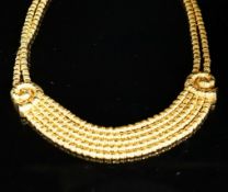 Ilias Lalaounis: a 750 yellow metal multi strand necklace, with shell motifs, 40cm, 146.3 grams,