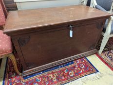 A large rectangular carved teak trunk, length 116cm, depth 58cm, height 64cm