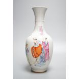 A Chinese porcelain vase, painted with figures and elephant in famille rose enamels, 25cm