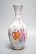 A Chinese porcelain vase, painted with figures and elephant in famille rose enamels, 25cm