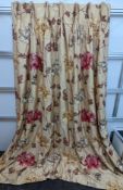 A pair of floral lined curtains. Approximate measurements: Width of top 110cm, Width of bottom 220cm