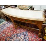 A late Victorian oak four drawer library table of curved rectangular form, length 240cm, depth 60cm,