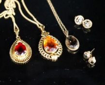 A modern 9ct gold and smoky quartz set pendant on a 9ct chain and two pairs of 9ct earrings, gross