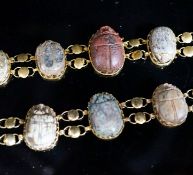 Two similar early 20th century yellow metal mounted scarab bracelets (a.f.), 18.5cm et infra,