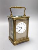 A French brass repeating carriage clock with key. 13.5cm