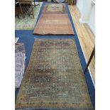 Three antique rugs, Caucasian and North West Persian, largest 230 x 154cm