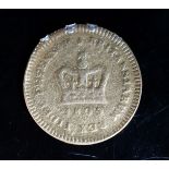 A George III 1809 gold one third guinea coin.