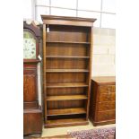 A reproduction mahogany open bookcase, length 102cm, depth 33cm, height 229cm