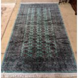 A Bokhara green ground carpet, 282 x 184cm