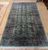 A Bokhara green ground carpet, 282 x 184cm