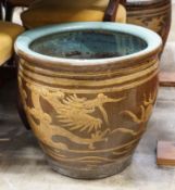 A pair of Chinese style circular glazed earthenware planters, diameter 50cm, height 47cm