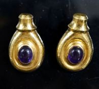Attributed to Ilias Lalaounis, a pair of planished 750 yellow metal and cabochon amethyst set