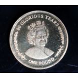 A 2006 Elizabeth II Gibraltar gold one pound coin.